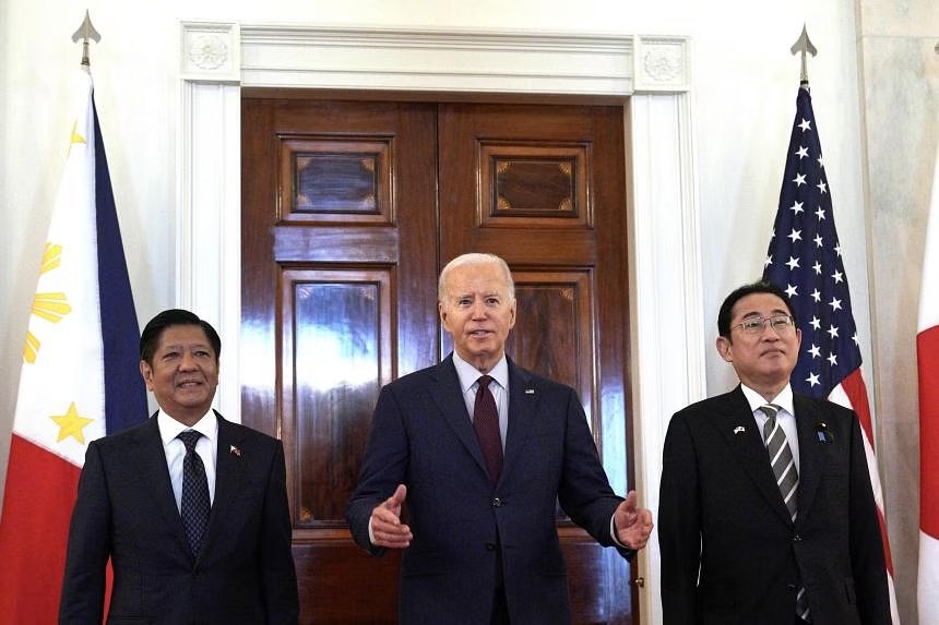 Biden warns on Beijing's South China Sea moves in Philippines-Japan summit